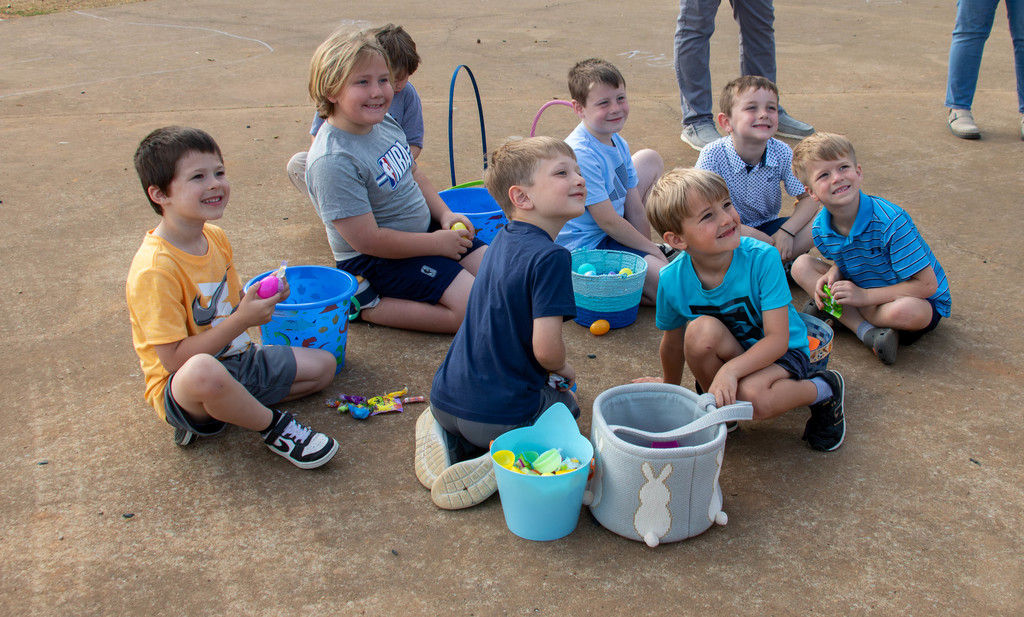 boys and easter egg baskets looking at camera