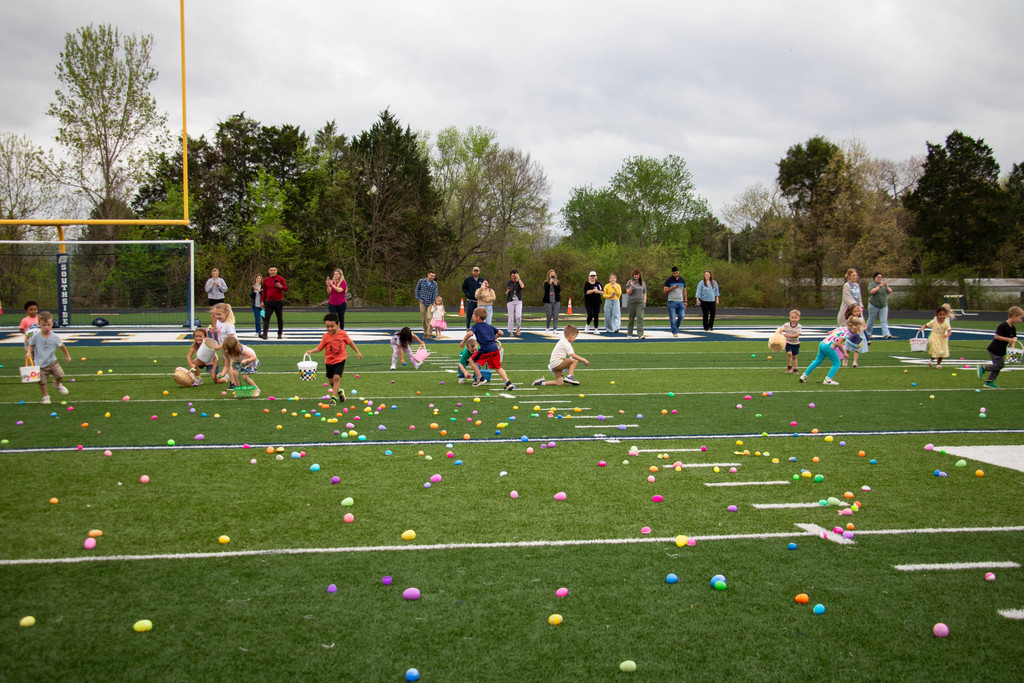 preschoolers hunting easter eggs
