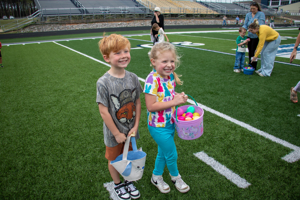 boy and girl holding easter baskets
