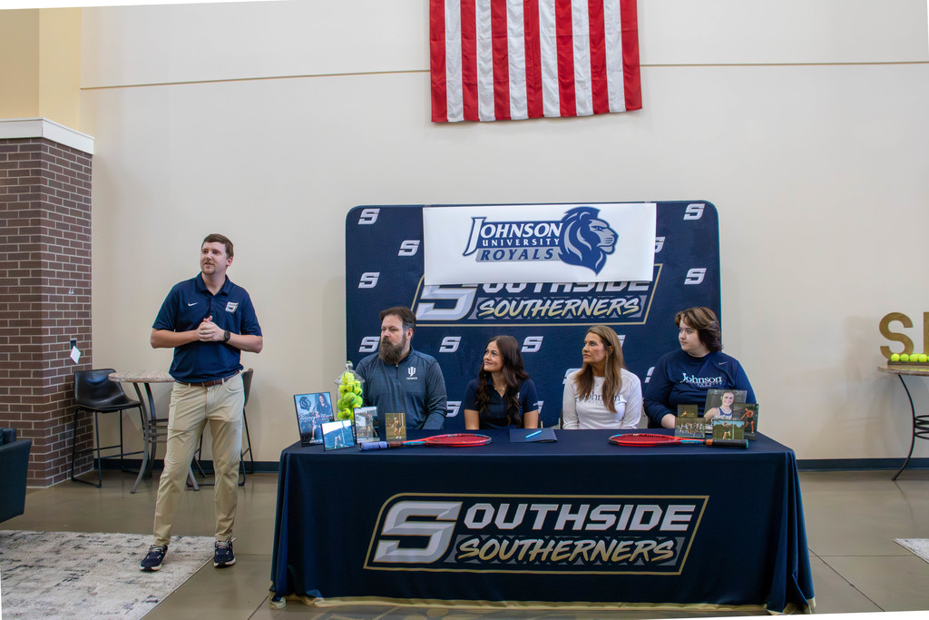 Coach talking student and family listening