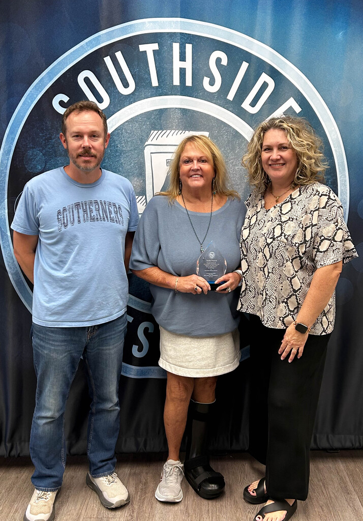 three people smiling