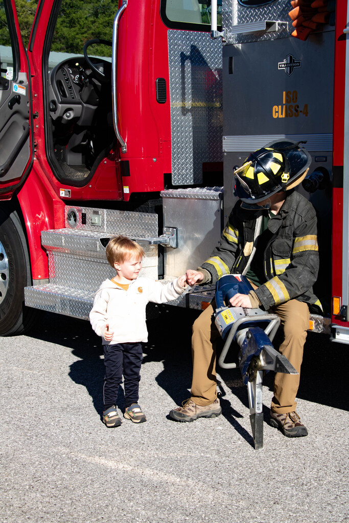 Preschooler with firefighter
