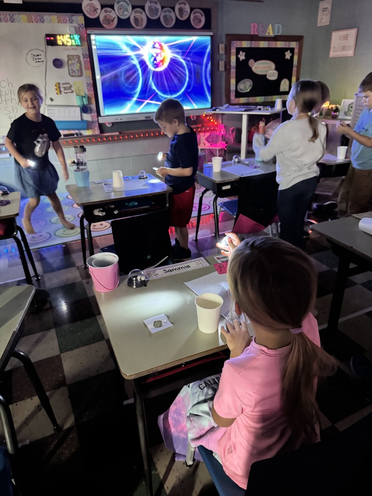 Mrs. Kline's first graders lit up science class making star projectors! They discovered why stars twinkle at night but hide during the day. The lesson ended with an impromptu disco dance party. 