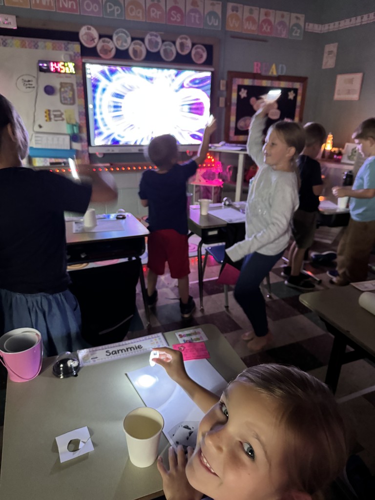 Mrs. Kline's first graders lit up science class making star projectors! They discovered why stars twinkle at night but hide during the day. The lesson ended with an impromptu disco dance party. 
