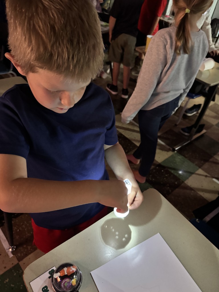 Mrs. Kline's first graders lit up science class making star projectors! They discovered why stars twinkle at night but hide during the day. The lesson ended with an impromptu disco dance party. 
