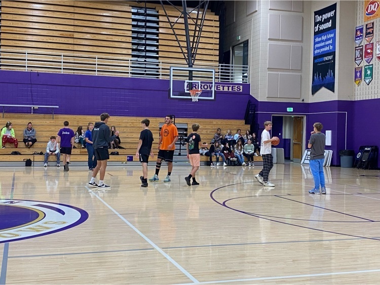 students playing basketball