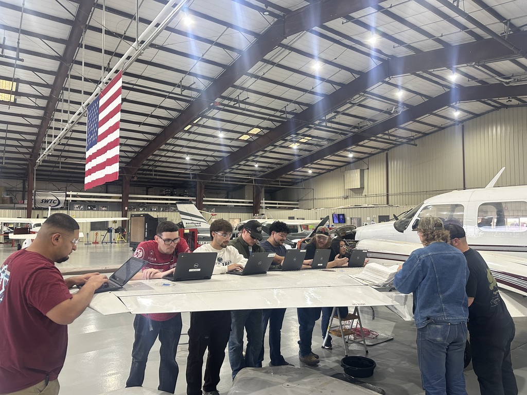 Students inspect De-icer boots