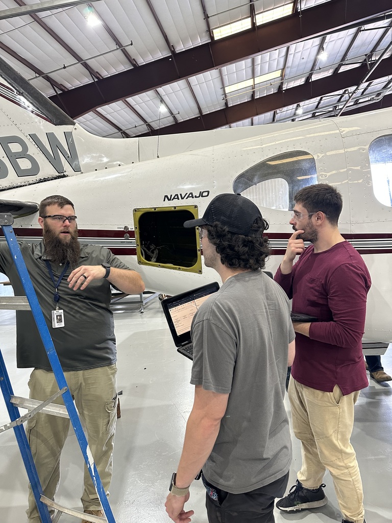 Instructor gives lesson about inspecting a aircraft de-icer boot