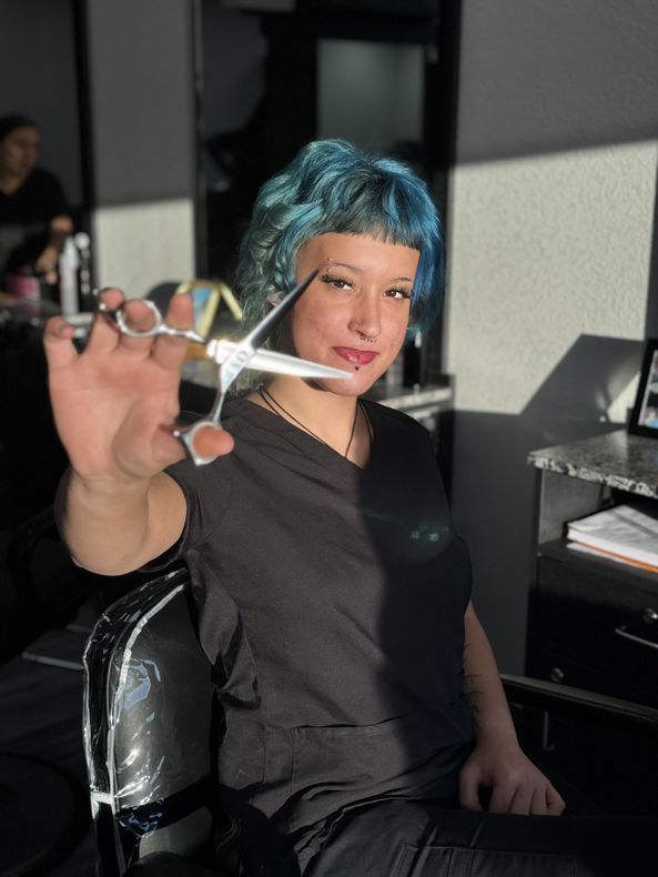 Kai Buford with scissors