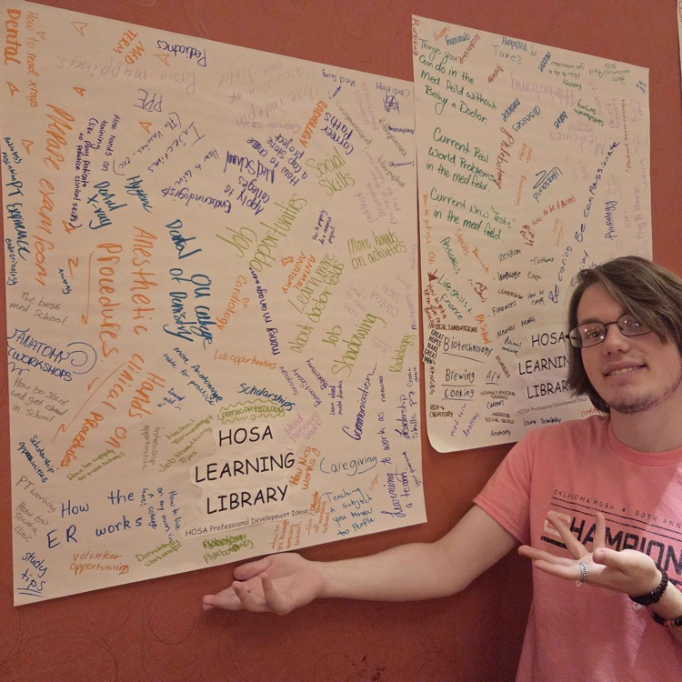 man in front of poster