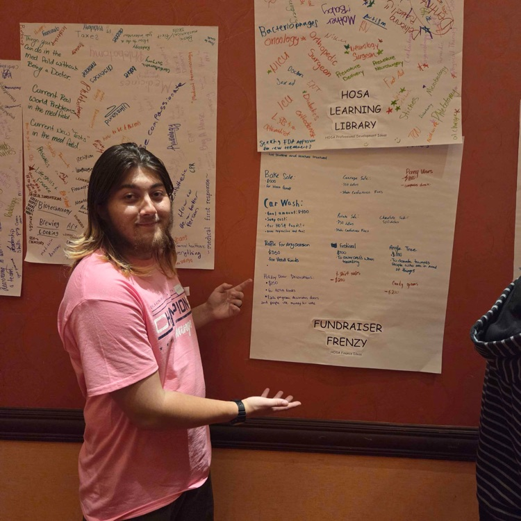 man in front of poster