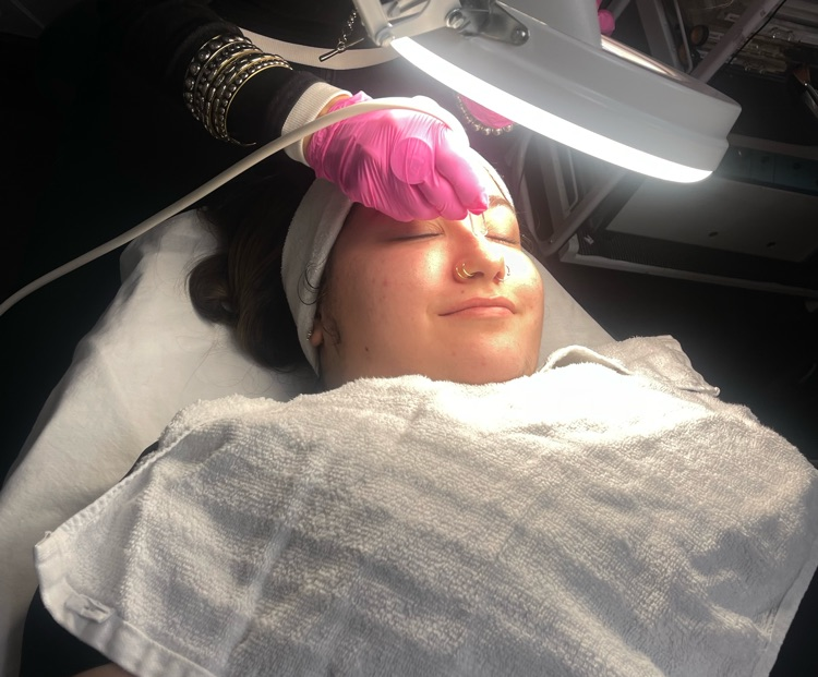 women receiving facial