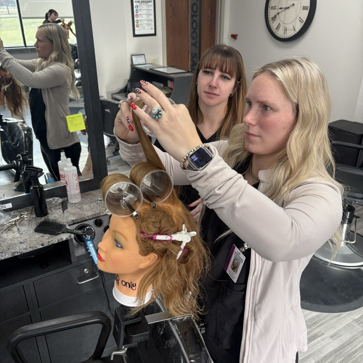 young women working on perm using plastic cups