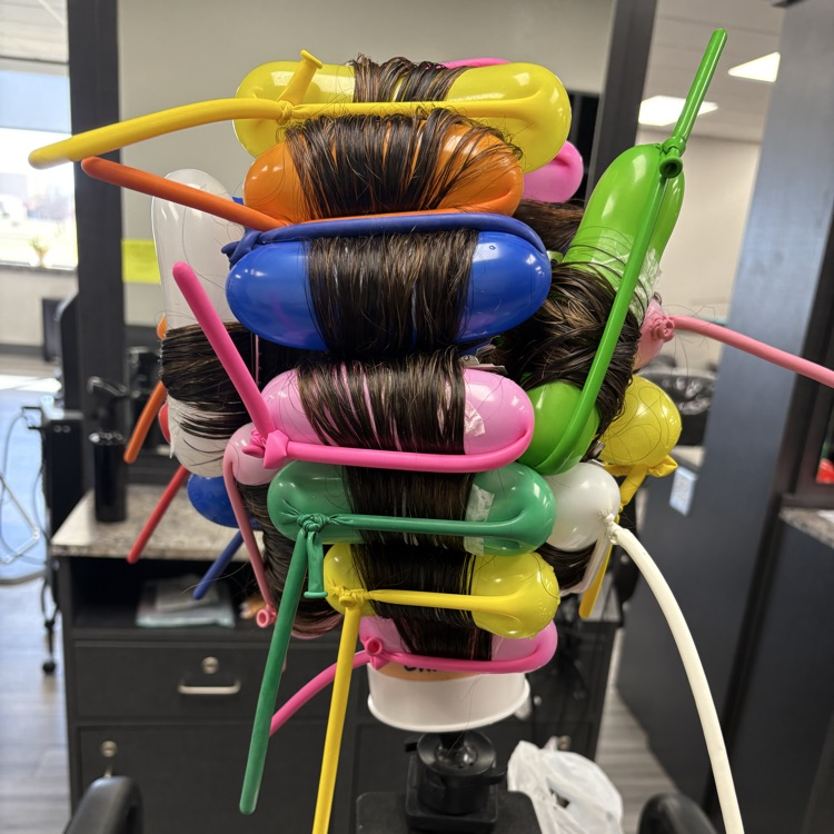 balloons in place of perm rods on mannequin head
