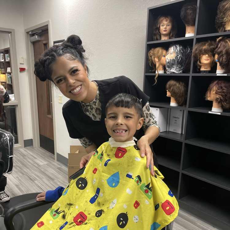 child getting haircut