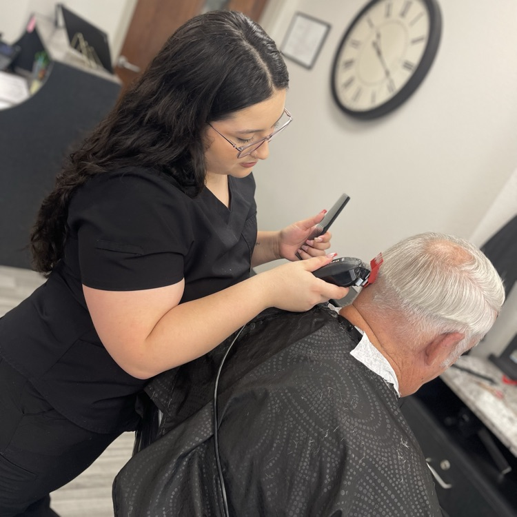 Cosmology student performing men’s clipper cut