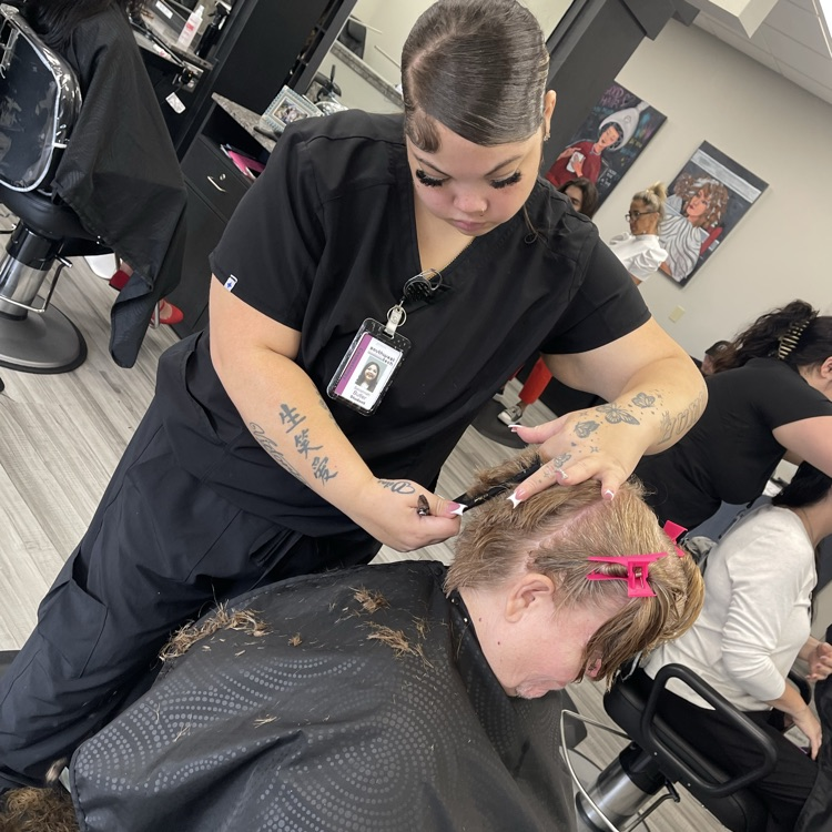 Cosmology student performing men’s clipper cut