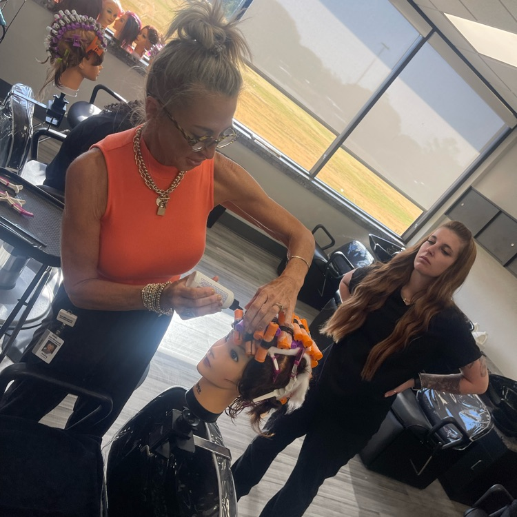 instructor going over what to do after perm rods on in 