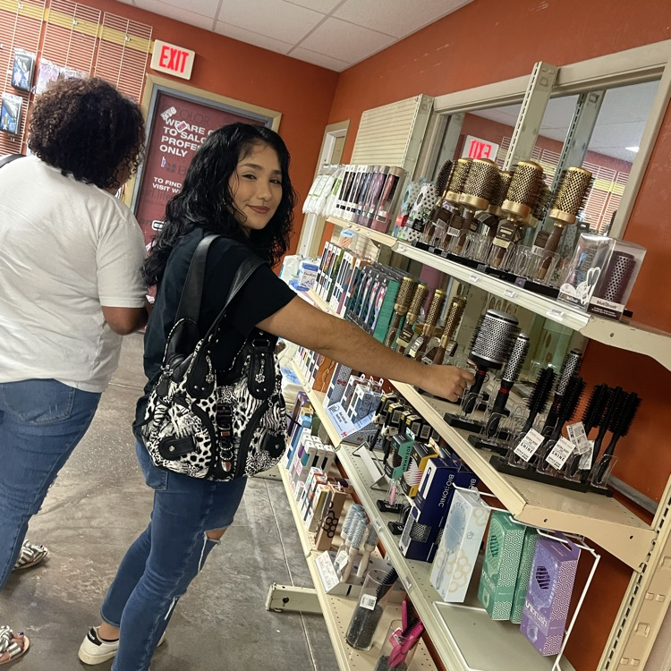 c Cosmo students browsing beauty store 