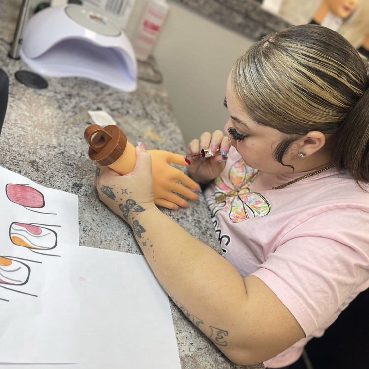 Cosmo students doing nails 
