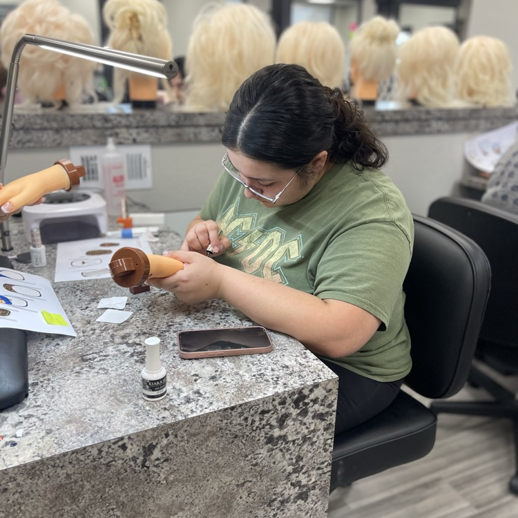 Cosmo students doing nails 