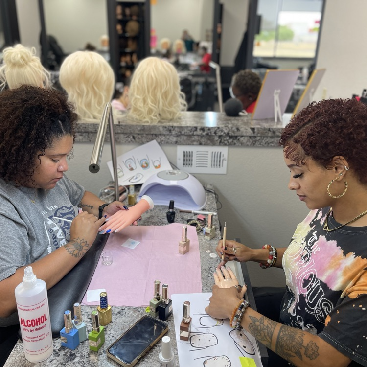 Cosmo students doing nails 