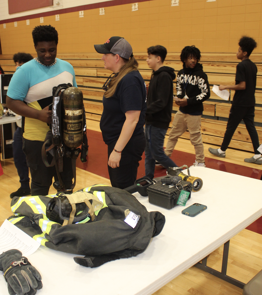 student with firefighter