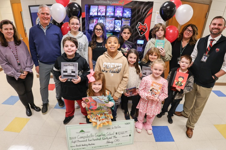 CGS book vending machine ribbon cutting