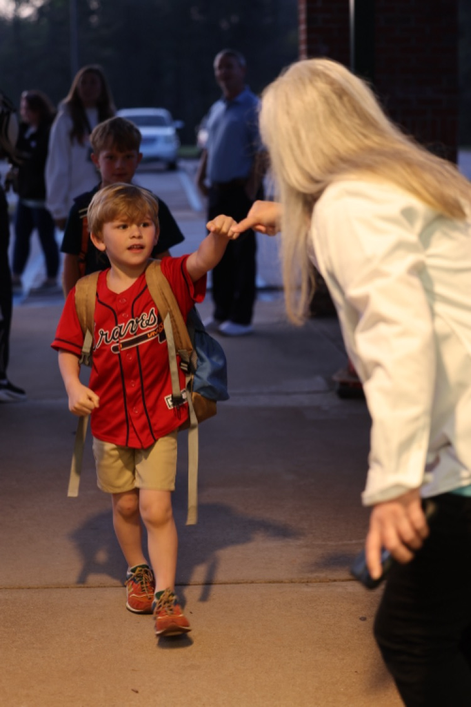 elementary student fisting with admin