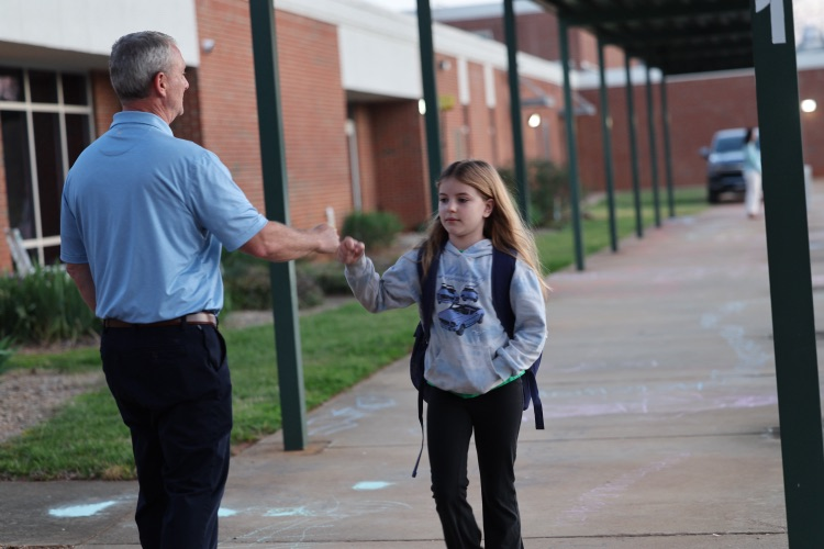 elementary student fisting with admin