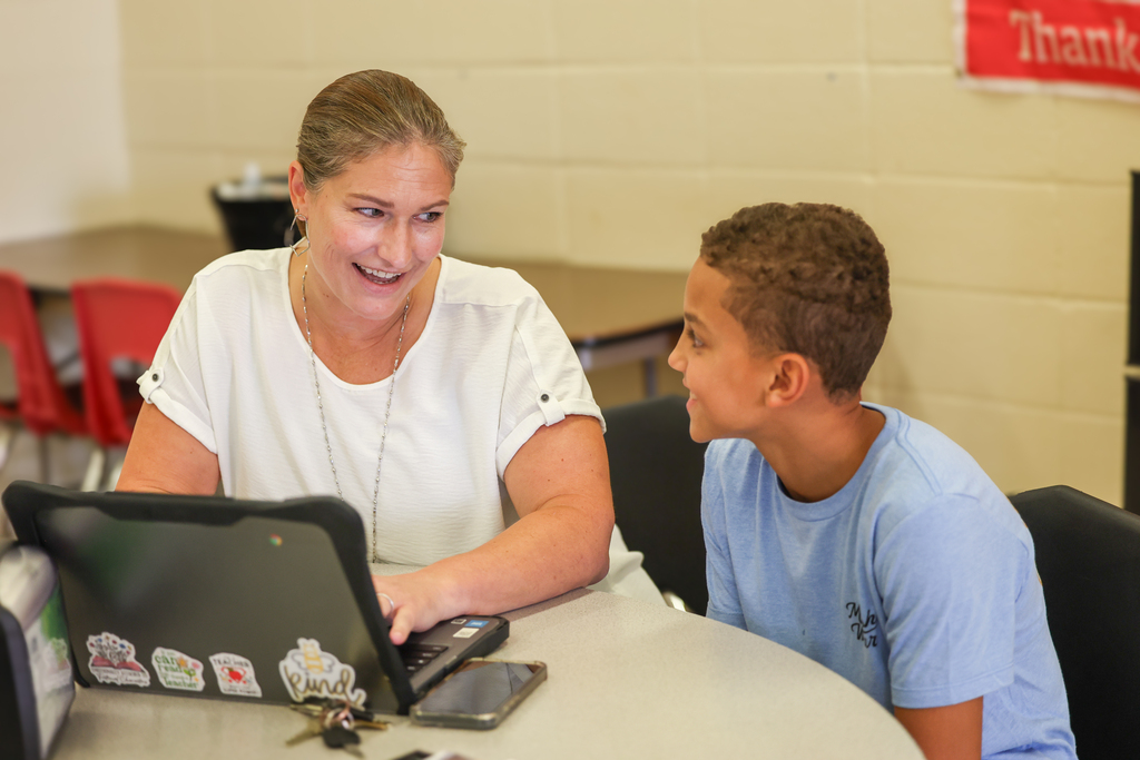 principal with a student talking