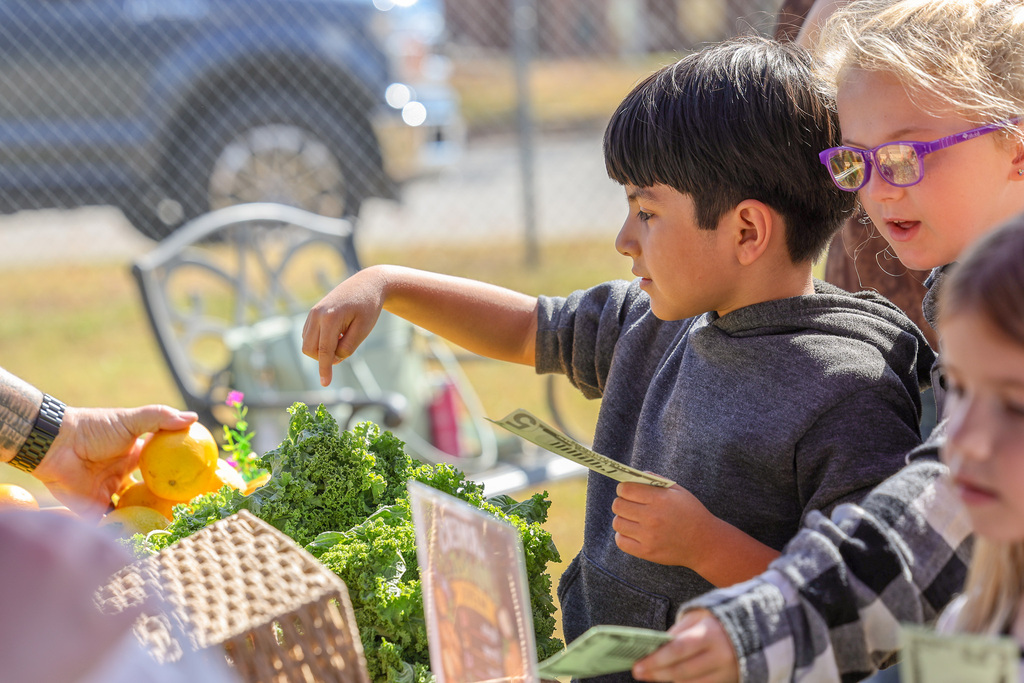 Student Buying Food at the farmers market