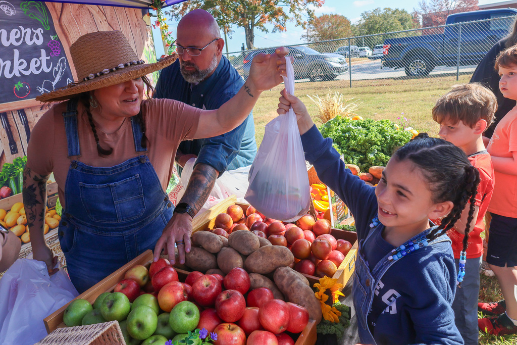 Student Buying Food at the farmers market