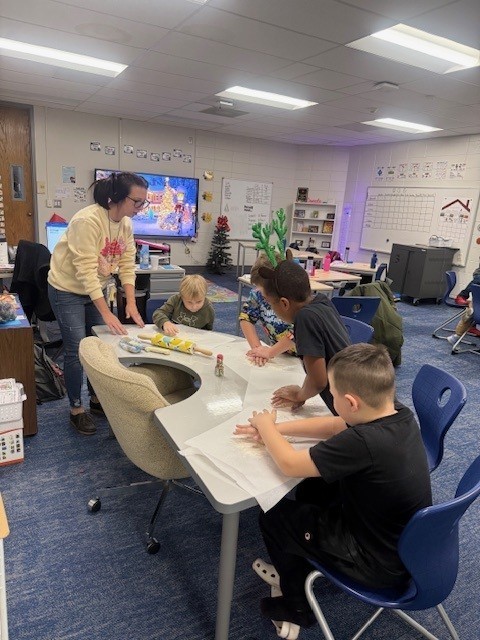 Students make gingerbread cookies
