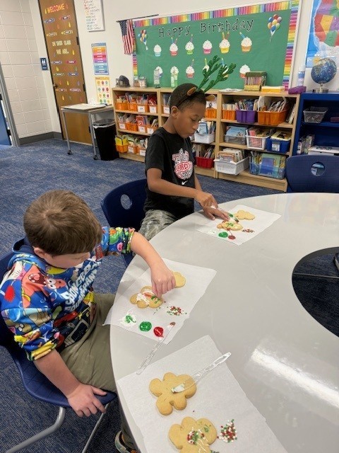 Students make gingerbread cookies