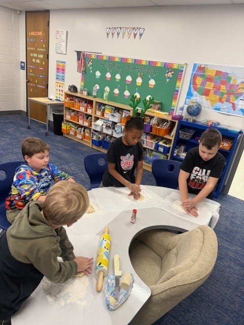 Students make gingerbread cookies