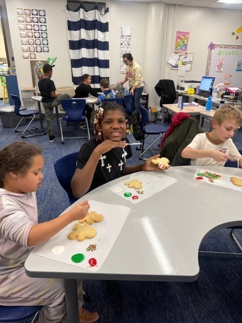 Students make gingerbread cookies