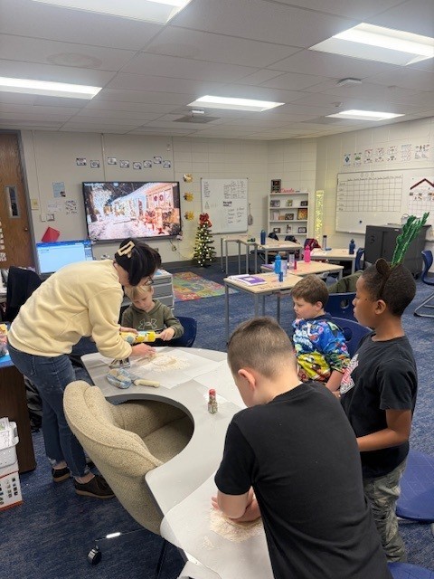 Students make gingerbread cookies