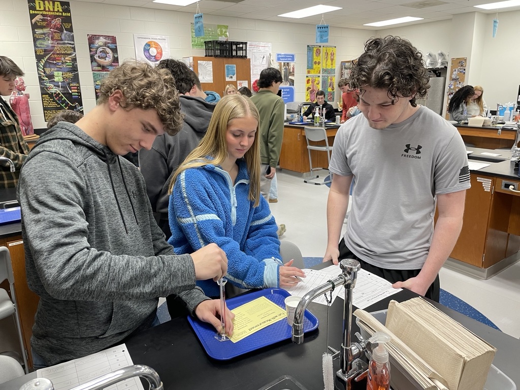 Mrs. Dubois's chemistry classes brush up on their measurement skills in this station's activity.