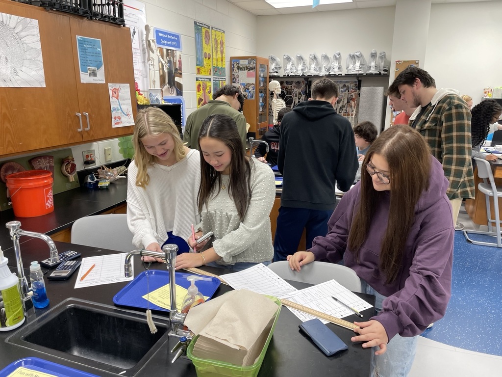 Mrs. Dubois's chemistry classes brush up on their measurement skills in this station's activity.