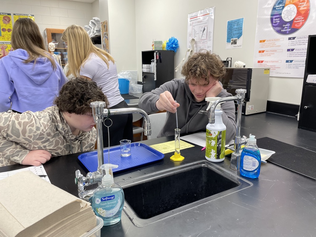 Mrs. Dubois's chemistry classes brush up on their measurement skills in this station's activity.