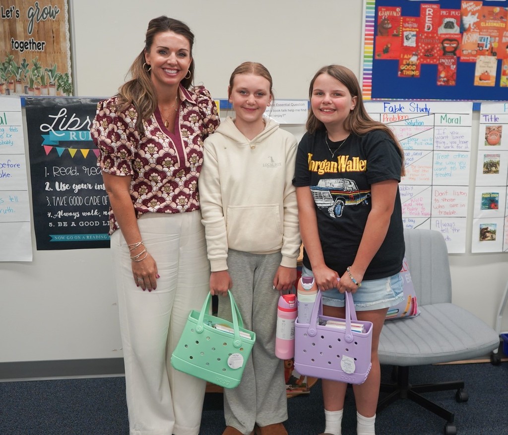 Each year, students at Cowpens Elementary School compete in Broad River Electric Cooperative's Children's Book Challenge.  We are proud to share that three Cowpens Elementary 5th grade students were selected as winners! Juniper Symons won the individual contest, while Joanna Patton and Sophia Coyle won the partner contest.  Students participating in the challenge are required to write and illustrate a children's book. This year's theme was "A Day in the Life of a Lineman."   Juniper, Joanna and Sophia won out of all students in Spartanburg, Cherokee and Union counties! They completed their research and wrote their books while in Mrs. Summey's library class.   Congratulations!