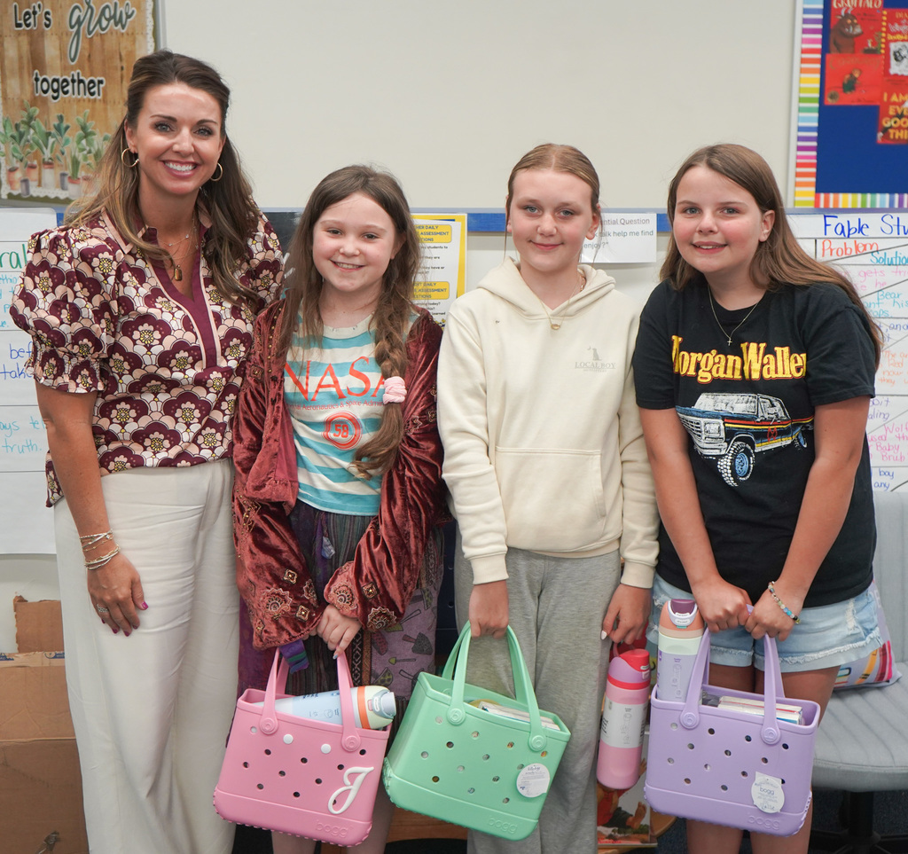 Each year, students at Cowpens Elementary School compete in Broad River Electric Cooperative's Children's Book Challenge.  We are proud to share that three Cowpens Elementary 5th grade students were selected as winners! Juniper Symons won the individual contest, while Joanna Patton and Sophia Coyle won the partner contest.  Students participating in the challenge are required to write and illustrate a children's book. This year's theme was "A Day in the Life of a Lineman."   Juniper, Joanna and Sophia won out of all students in Spartanburg, Cherokee and Union counties! They completed their research and wrote their books while in Mrs. Summey's library class.   Congratulations!