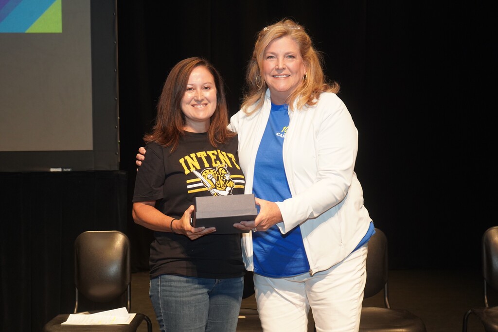 Dr. Julie Fowler awards Mrs. Marie Fox with the D3 Teacher of the Year and BHS Teacher of the Year award.