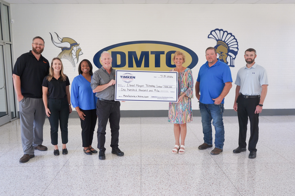 Representatives from Timken Duncan present a $100,000 check to DMTC Director Dr. Nikki Honeycutt. The grant will be used to enhance welding and advanced manufacturing programs at the school.