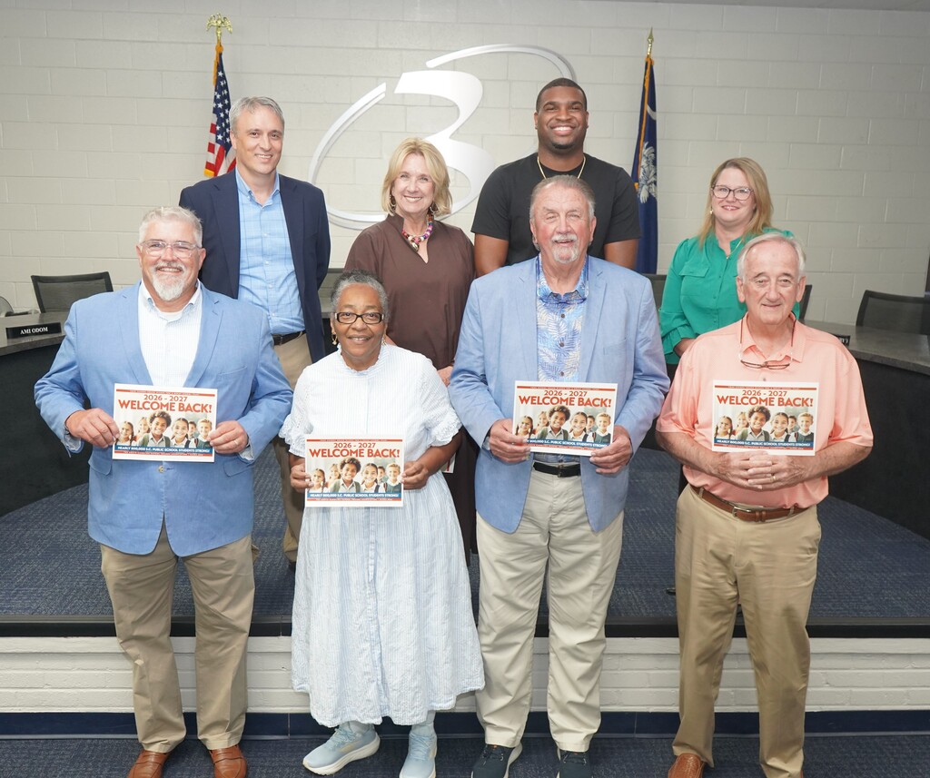 This photo shows the D3 Board of Trustees wishing students a happy and successful 2026-27 School Year!