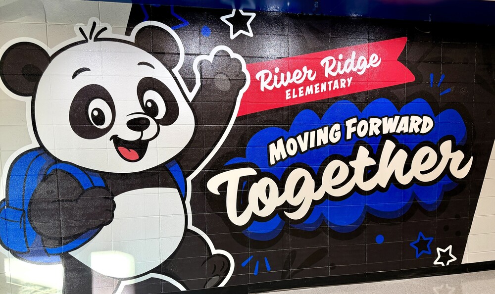 new panda mural in front lobby with the words River Ridge Elementary Moving Forward Together