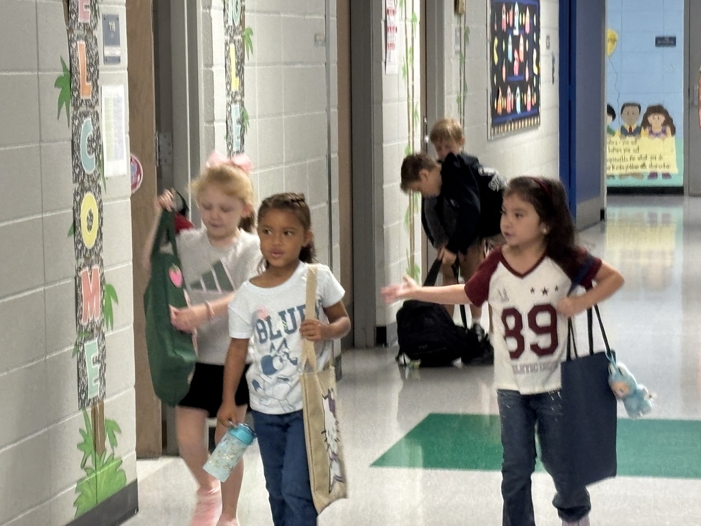 K5 heading straight down the hallway to their classrooms.