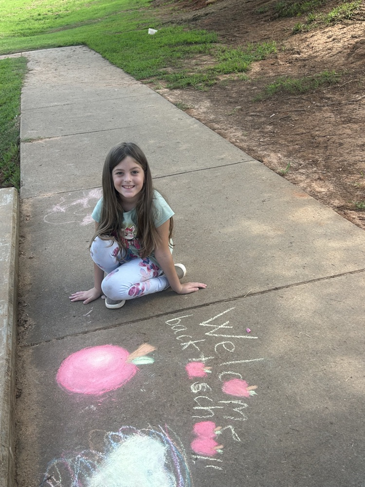 student with chalk drawing