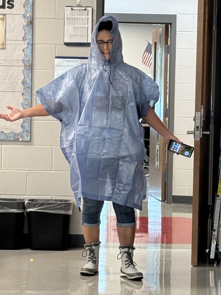teacher in poncho